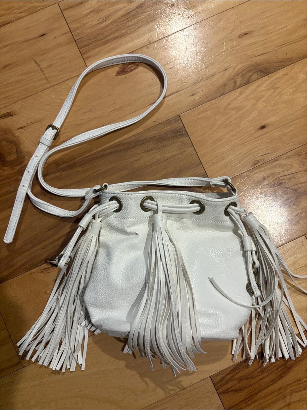Carlos by Carlos Santana White Fringe Drawstring Crossbody Bag